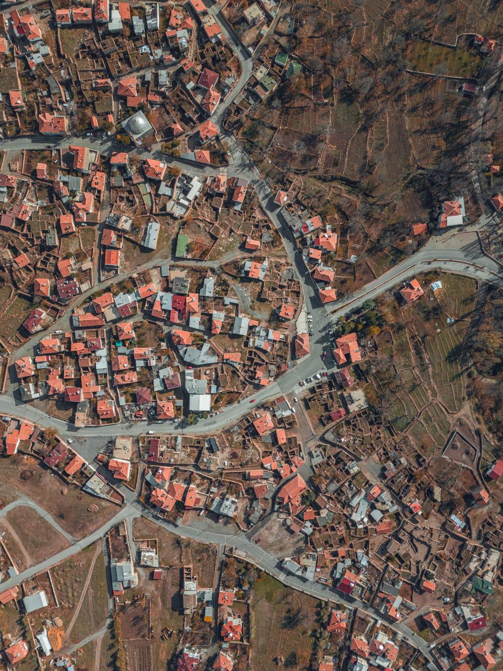 Aerial view of a dense town with red roofs